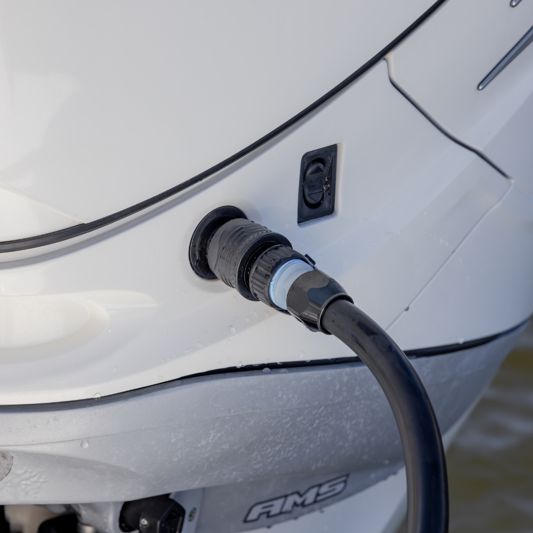 Flushing hose attached to an outboard through a Quick Connect adapter