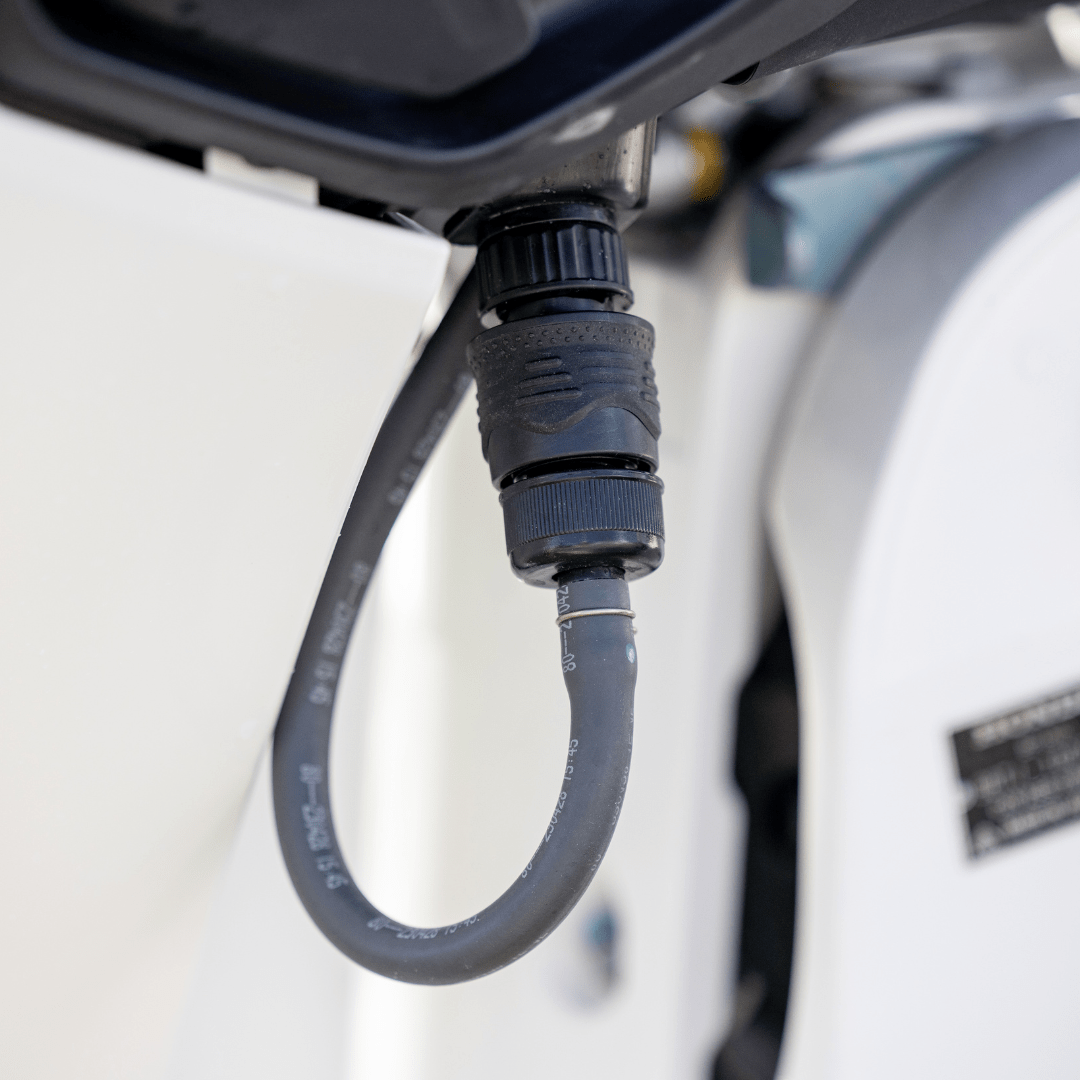 close up of honda engine flush port quick connect