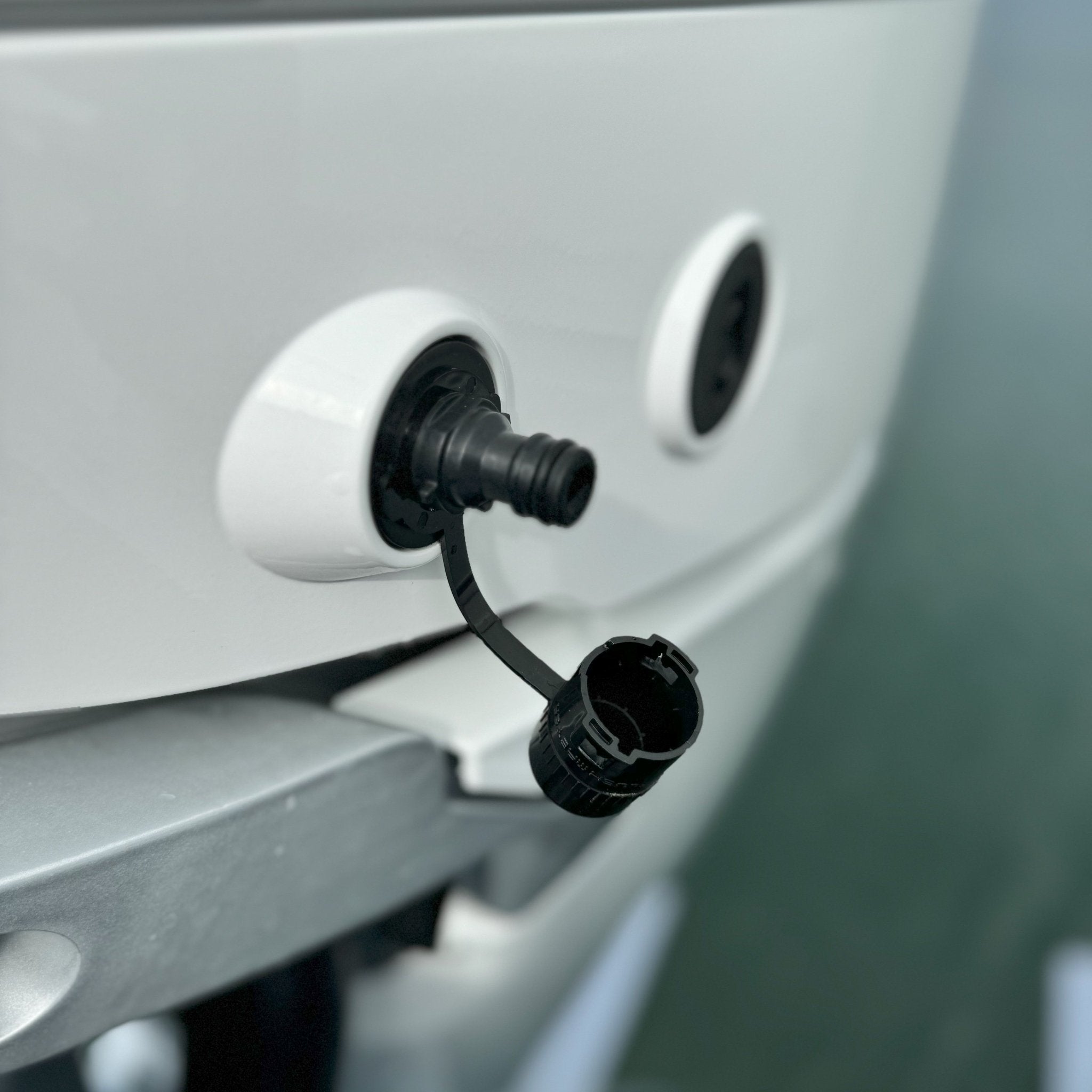 close up of flush port quick connect for mercury outboards cap off