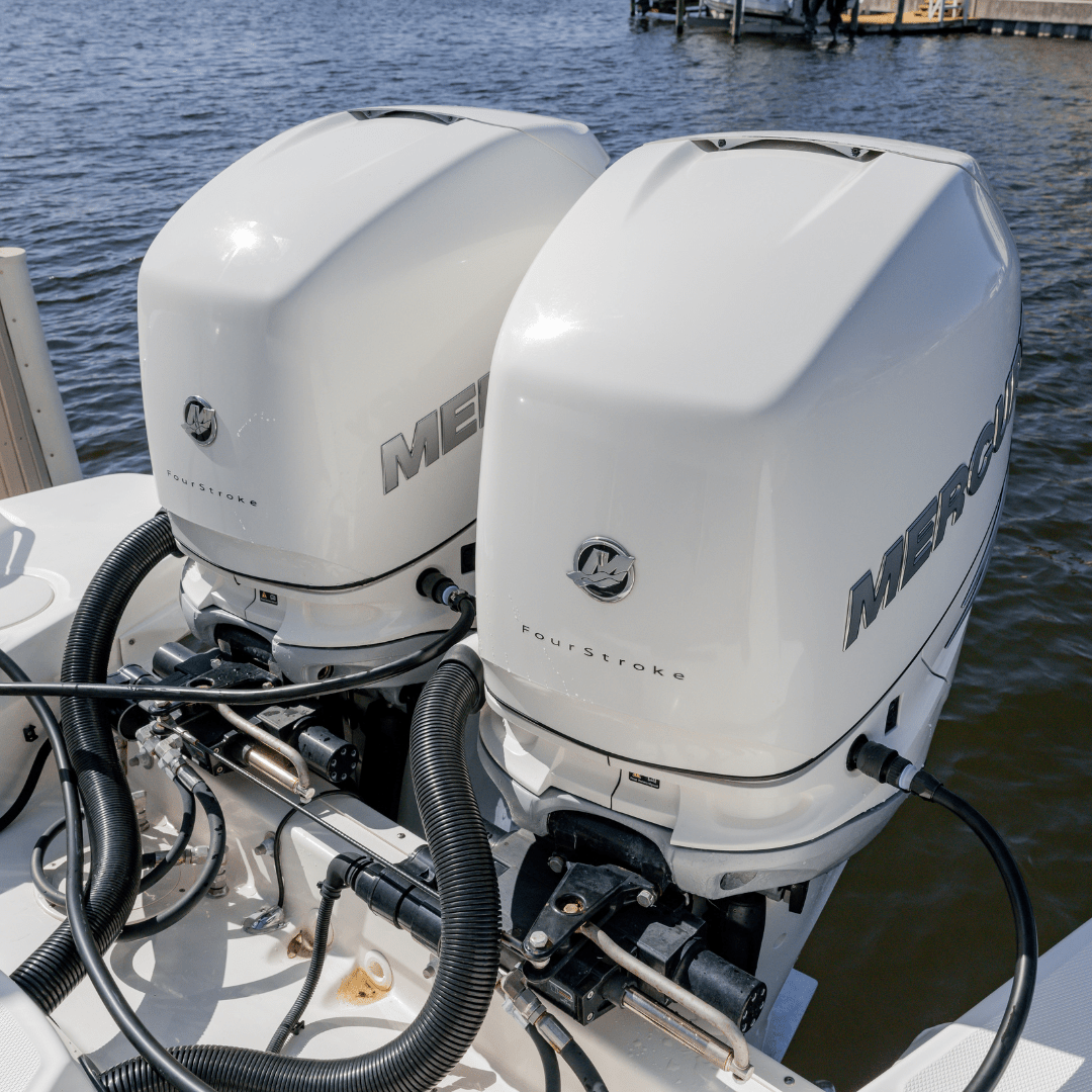 Flushing Quad Mercury Fourstroke outobards on boat lift with Flushmaster and Quick Connects