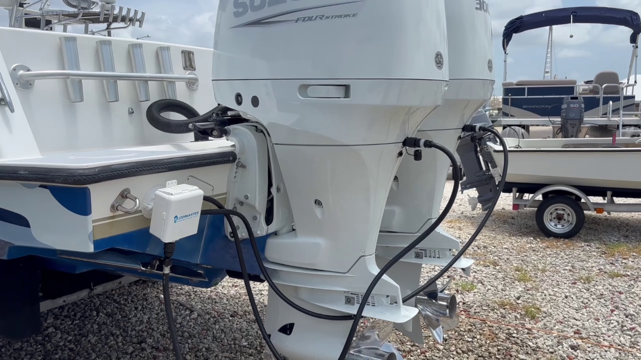 flushing dual suzuki outboards with flushmaster controller mounted on boat with seasucker attachment