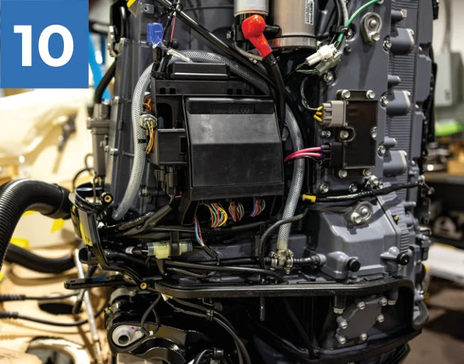 New flush hose routed through the cowling into the engine area.