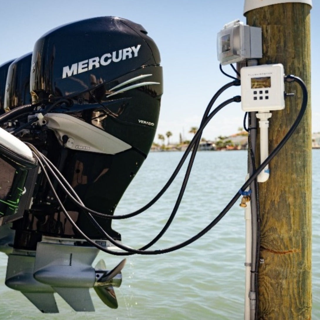 Flushmaster system in use flushing triple Mercury outboards, demonstrating the product’s effectiveness in marine engine maintenance.