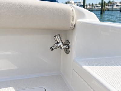 Illustrative 45-degree Water Spigot installation below the padded gunwale on a center console boat