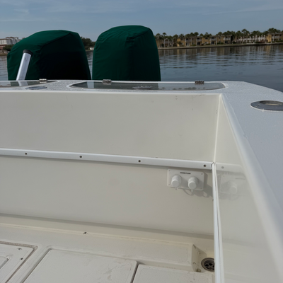 close-up of boat gunwale with flush port reroute plate and quick connect