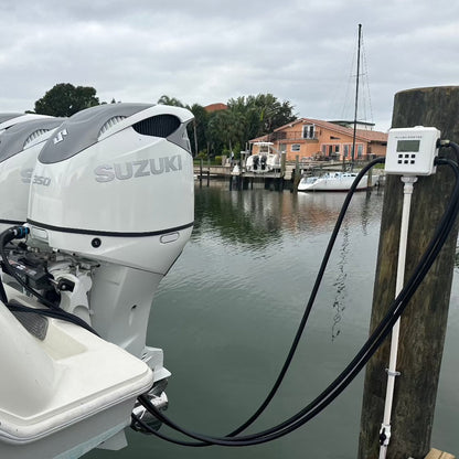 Flushmaster system efficiently flushing triple Suzuki motors, demonstrating its capability to maintain multiple outboard engines simultaneously.