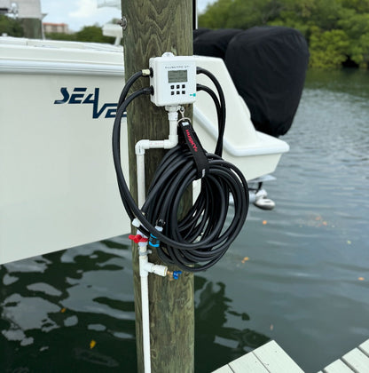 Dock-mounted flushing kit connected to the Flushmaster system, designed for efficient and secure marine engine maintenance.