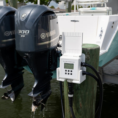 flushmaster controller housed in cradle mounted to dock piling flushing dual yamaha outboards