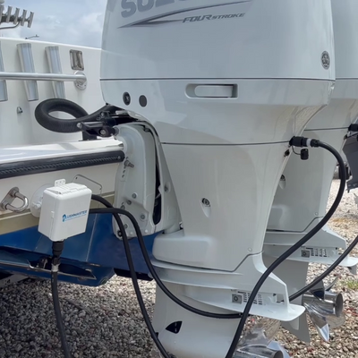 flushing dual suzuki outboards with flushmaster controller mounted to boat with seasucker attachment