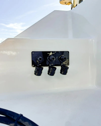Black triple-outlet Flush Port Reroute mounted horizontally with all three locking caps open.
