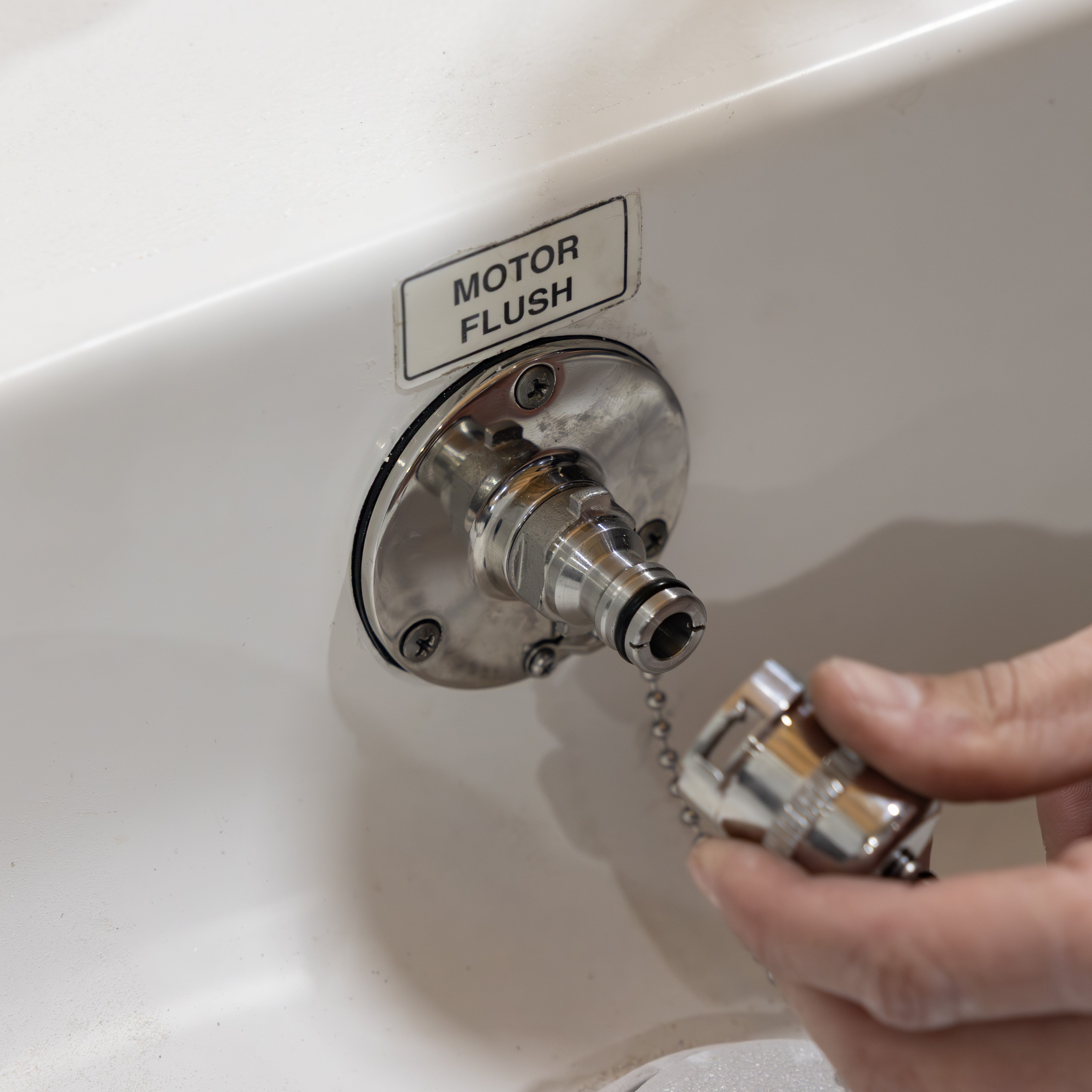 hand connecting locking cap to water inlet outlet quick connect