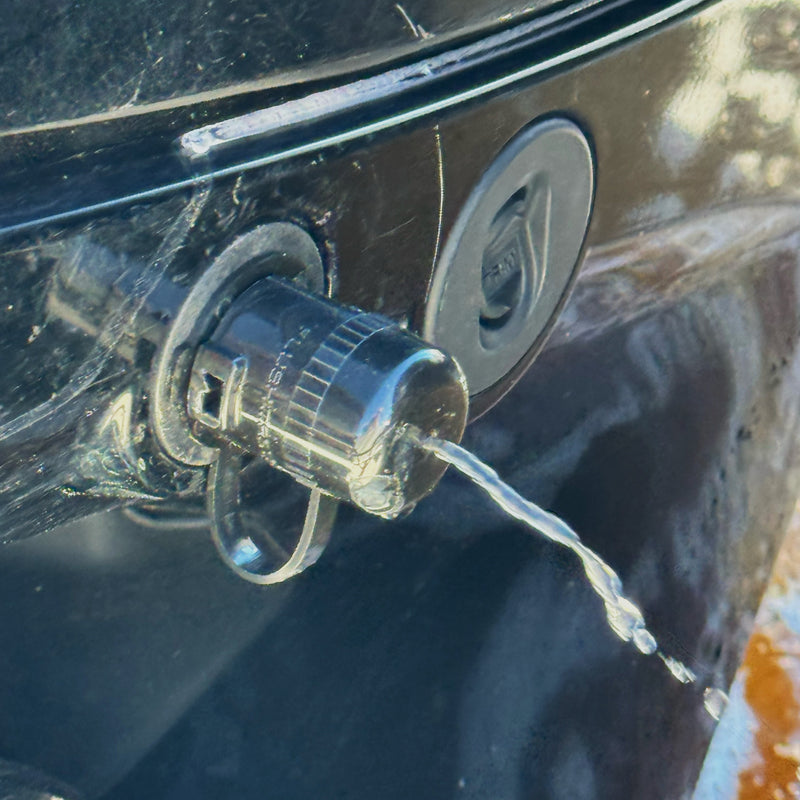 mercury flush port quick connect weephole in cap showing water leaking as sign of check valve issue