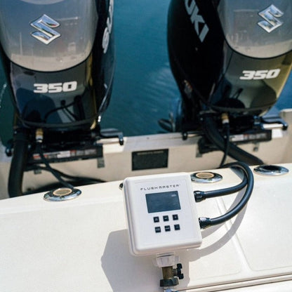 Flushmaster system flushing dual Suzuki outboard engines on a boat, showcasing efficient marine engine maintenance and reliability in saltwater conditions.