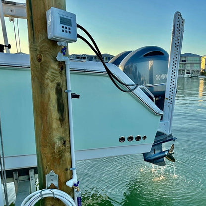 Flushmaster system mounted on a dock, connected to dual Yamaha outboard motors for efficient engine flushing.