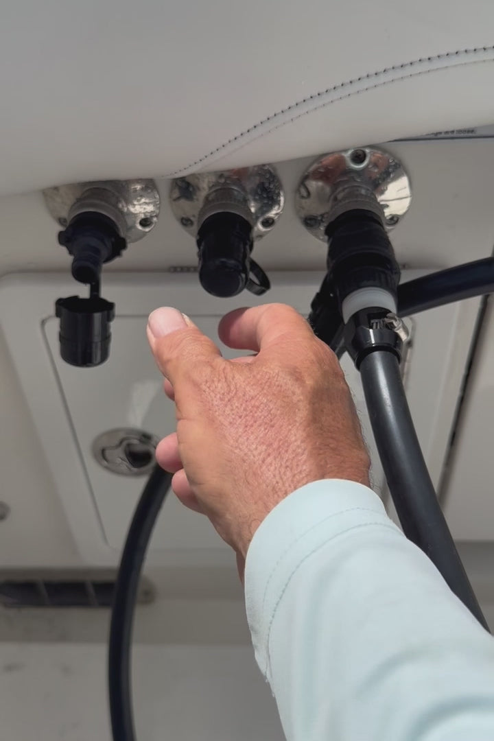 Load video: man using flush port quick connect for suzuki on standard water fittings to flush rerouted triple yamahas