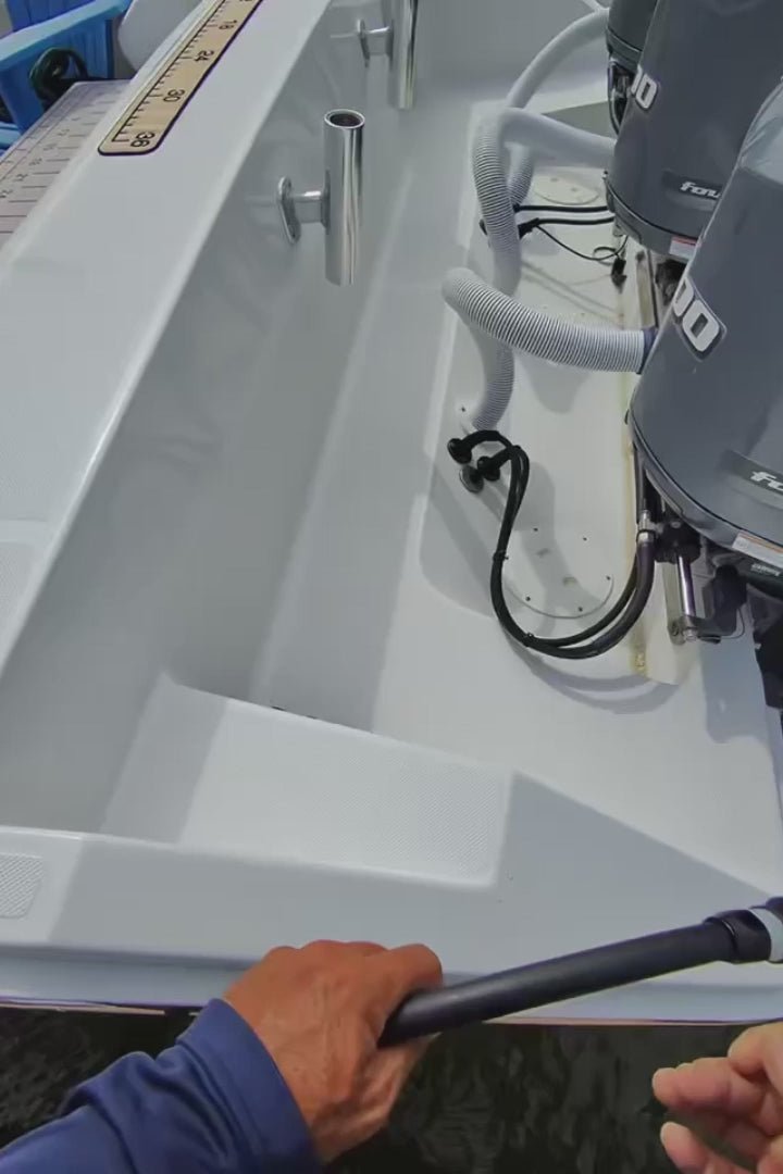 Load video: man connecting flushmaster flush hoses to black acrylic triple outlet flush port reroute to flush triple yamaha engines