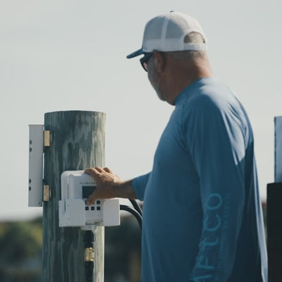 man pressing start on flushmaster controller